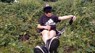 Cute French-Asian gay twink jerks off his shaved cock outside cums thick cum sticking to his fingers