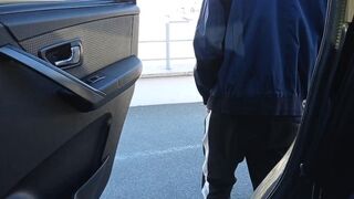 boy jerks off in a shopping mall parking lot