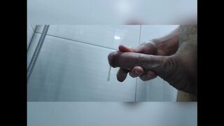 Young horny twink stroking his dick in the shower with a good load in the end