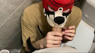 young guy sucks his friend's big dick in a public toilet