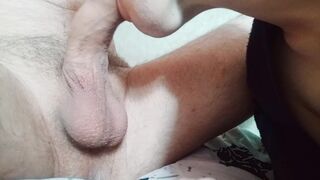 Close-up of a huge cock in the mouth of an obedient fucking Femboy