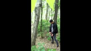 Bad boy jerks while smoking cigarette in a forest - almost caught - so his balls stay full