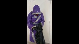 Putting on latex saint priest robe coat and rubber cape over schoolgirl sailor uniform, layers