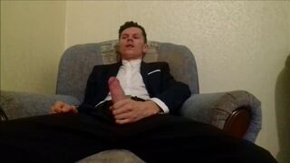After working in the office, the guy jerks off his cock and ends up in an office suit