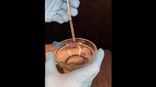 I put on blue gloves and use a syringe playing with my cum part 1