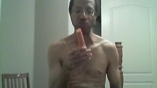 BLACK GAY STICKS CARROT IN ASS AND EATS IT
