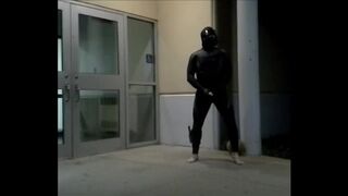 barefoot frogman cums inside a condom in front of hotel doors