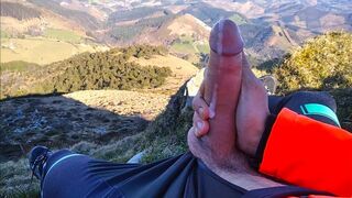 Jock in Fishnet Jerks his Big Fat Cock and Cums on Top of the Mountain