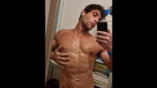 Very hot boy enjoys the power of the shower