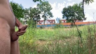 Public risky wanking and cumshot on the river near the street