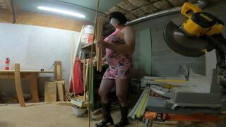 Big fake tits crossdresser in pink drees fishnets and heels doing wood work