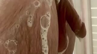 White college guy showering