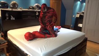carnage has fun with spiderman dummy