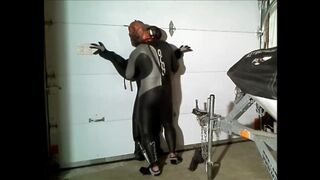 wetsuited spiderman captures orca