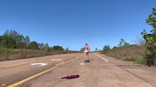 Stripping naked on a public road and jacking off before getting dressed again.