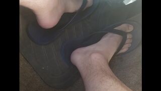 Male feet while driving