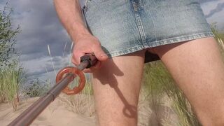 Naked on the beach I take off my skirt. Show, and play with ass. Then I pee.