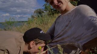 Summer fun of two young guys. Sucking by the sea