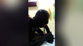 Latex Sissy In Chastity Throat Training