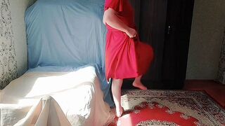 Stunning shemale brushing hair under warm golden sunlight