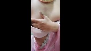 Indian Gay Crossdresser Gaurisissy Pressing and Playing with Her Big Boobs Looking in Pink Saree Looking Like a Housewife