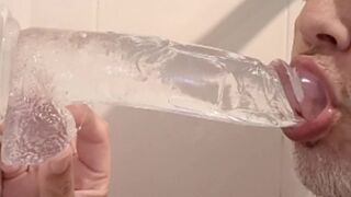 Amazing deepthroat till balls of a 23 cm huge dildo!