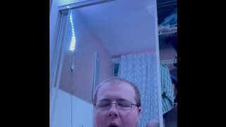 Chubby bi dude gives oral to big black dildo