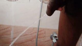 Rajesh pissing in the bathroom