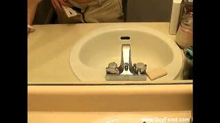 Gay guys William is attempting to tidy makeup off the bathroom mirror