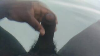 Thick black dick jerks off under water
