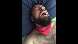 Big bearded and hairy bear wanking rubbing the bed sheet on his hard and wet cock. Beautiful Agony