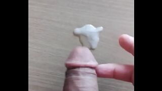handjob cumshot in front of a porn