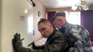 Two cops arrested guy in suit and spit piss and hit him