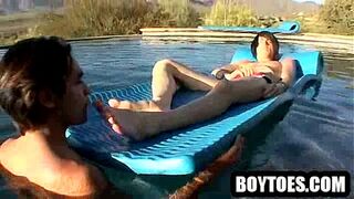 Stud has his nice toes sucked on in the pool