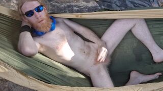 Nudist loses his clothes and cums for you in a hammock