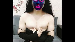 Masked and Mesmerizing: Sexy Dance in Black Outfit and Snow-White Skin