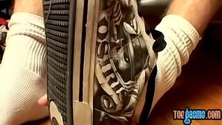 Thug jock Evan Heinze caressing socks in foot fetish solo