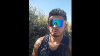 Manly and masculine twink touching each other in the sea outdoors - Latino