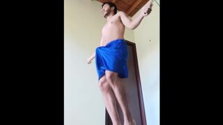 Guy working out bouncing his cock between his shorts ends up naked working out