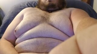 Chubby guy blows huge load on himself.