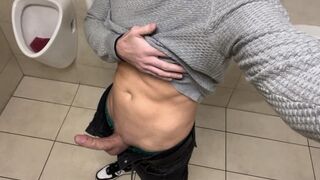 Cruising at urinals while jerking off at public toilet