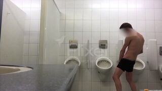 Exhibitionist boy is pissing in a urinoir - long gif video