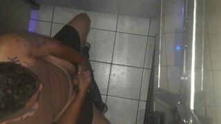 Popular guy sucks big black dick through the public gloryhole