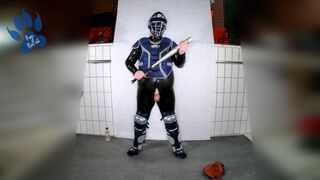 Rubber Catcher Pup having fun with baseball bat